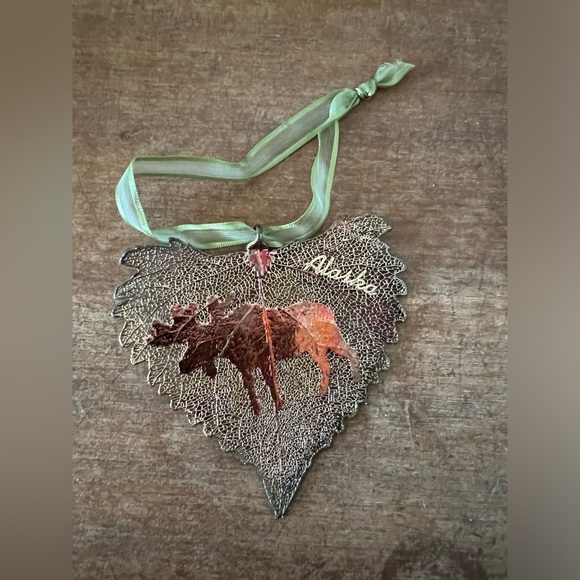 Metal plated Alaska Leaf shaped Christmas ornament with moose. - Picture 1 of 3
